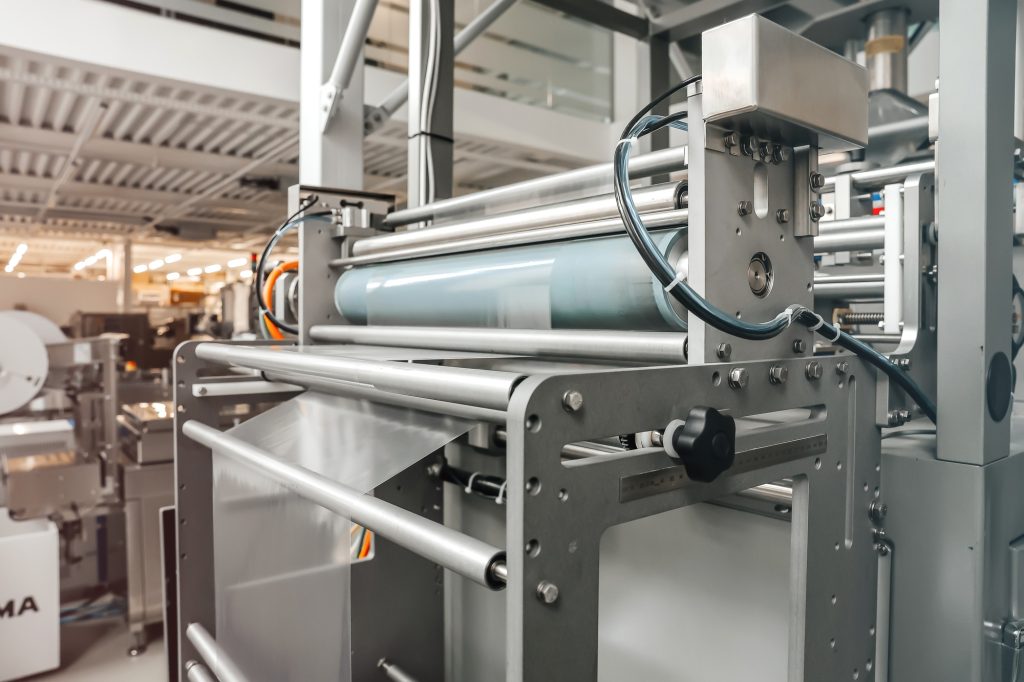 Processing of Packaging equipment thermoformer on food vacuum packaging sealing machine industrial