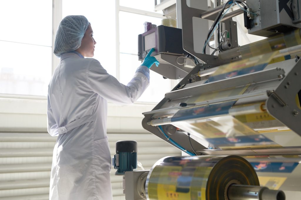 Woman Operating Packaging Machine