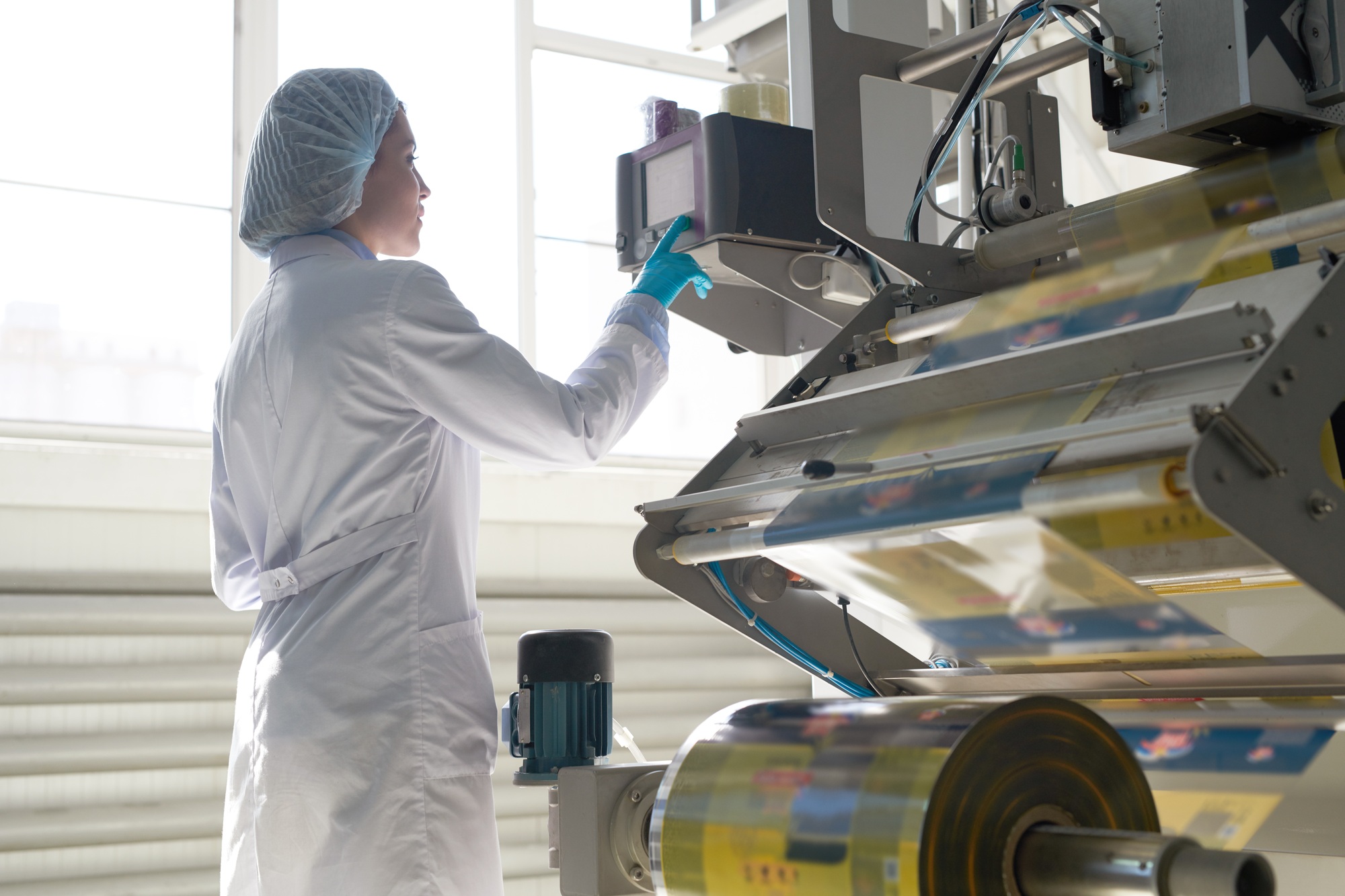 Woman Operating Packaging Machine